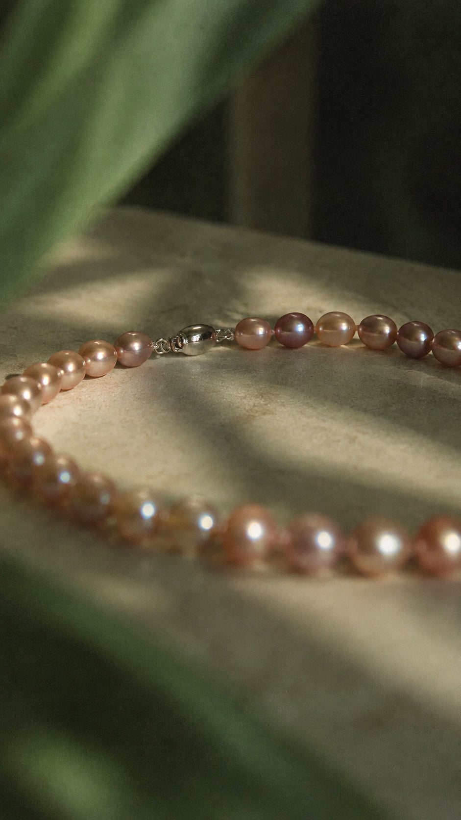 Lavender Oval Pearl Necklace, on the table