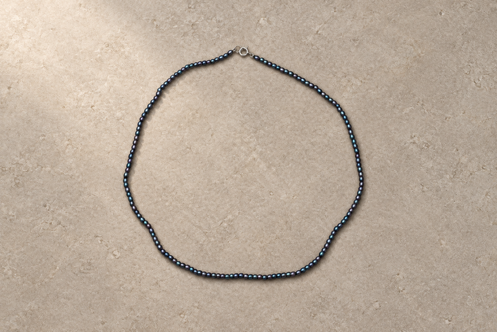 Tiny Black Pearl Necklace, in warm light