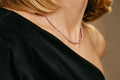 Tiny Lavender Pearl Necklace in warm light