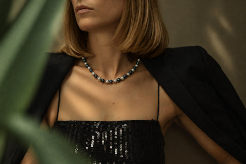 Grey Pearl Necklace with Silver Details, worn